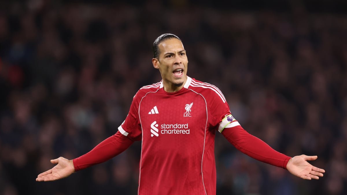 Wolves and Liverpool players battling for possession during an FA Cup match at Molineux Stadium.