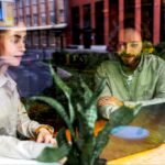 A person building a business with blocks, symbolizing foundational growth and strategic development for a solo agency.