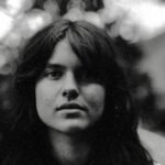 AI Impersonation and Copyright Trolls: A Folk Musician's Digital Nightmare 8 Folk musician Murphy Campbell, central to a story about AI music fakes and copyright issues, against a backdrop suggesting digital and musical themes.