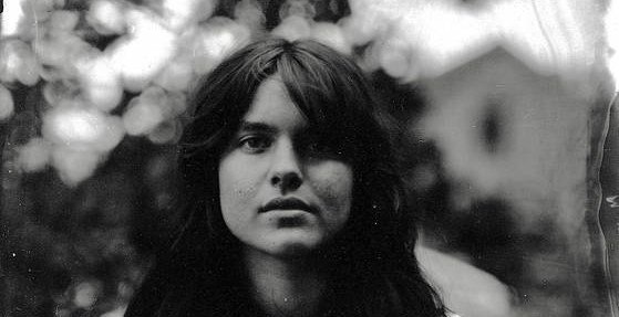 AI Impersonation and Copyright Trolls: A Folk Musician's Digital Nightmare 7 Folk musician Murphy Campbell, central to a story about AI music fakes and copyright issues, against a backdrop suggesting digital and musical themes.