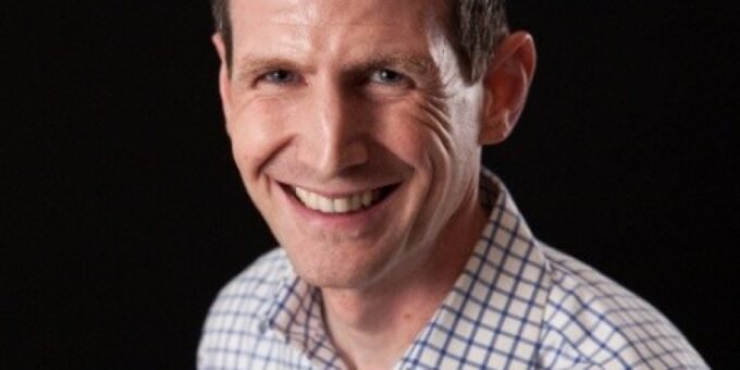 A person looking at a digital screen with AI-related graphics, symbolizing the impact of artificial intelligence on the workforce.