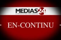 Vue aérienne des Villas d'Anfa Marrakech, avec piscines et jardins luxuriants sous le soleil marocain, et l'Atlas en arrière-plan.