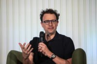 A visual representation of code repositories on GitHub, possibly with Anthropic's logo or a generic AI symbol, illustrating the accidental takedown event.