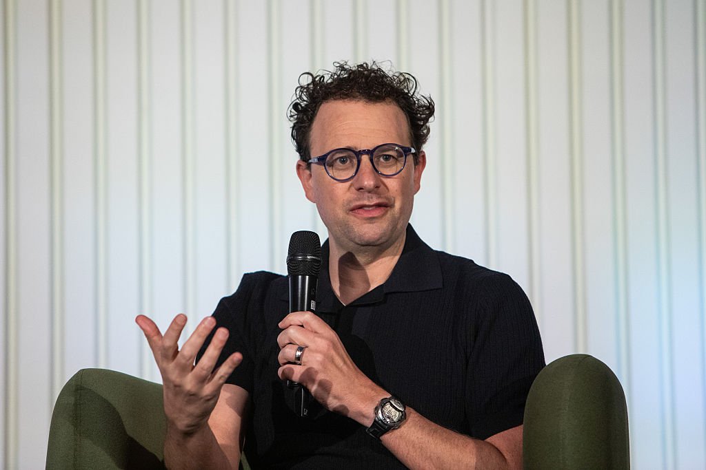 A visual representation of code repositories on GitHub, possibly with Anthropic's logo or a generic AI symbol, illustrating the accidental takedown event.