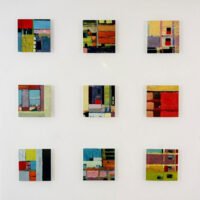 Barry Ginder's abstract plexiglass art showcasing urban landscapes and architectural designs.