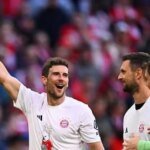 Bayern Munich players celebrating their 35th Bundesliga title victory at Allianz Arena.