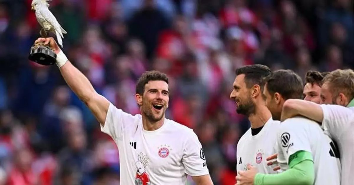 Bayern Munich players celebrating their 35th Bundesliga title victory at Allianz Arena.