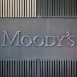 Bitcoin's Historic Leap: Moody's Rates First Public Crypto-Backed Bond 5 A conceptual image representing Bitcoin's integration into traditional finance, possibly showing a Bitcoin logo alongside financial charts or buildings.