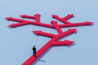 Bitcoin logo against a backdrop of stock market charts, symbolizing its underperformance against equities.