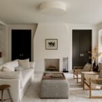 Exterior view of the renovated Croton-on-Hudson stone residence by Ravi Raj, showcasing the blend of original masonry and modern lap siding.