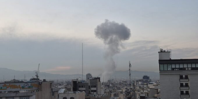 Dell logo against a backdrop of a map of the Middle East, symbolizing corporate presence amidst regional challenges.