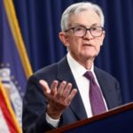 Federal Reserve building facade, symbolizing the central bank's latest decision on interest rates amidst internal dissent.