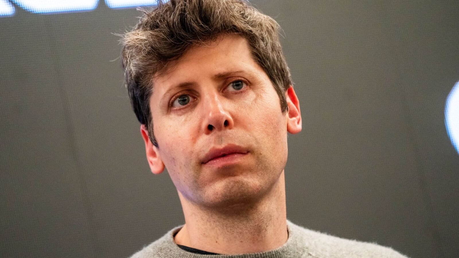 OpenAI CEO Sam Altman during a media tour of a Stargate AI data center, symbolizing the company's commitment to advanced AI development.
