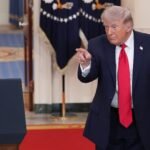 U.S. President Donald Trump speaking from the Cross Hall of the White House, addressing national security matters.