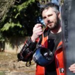 Unleashing the Future of Skiing: My Journey to Jet-Powered Slopes 6 A person skiing down a snowy mountain with electric jet engines strapped to their arms, creating a powerful thrust.