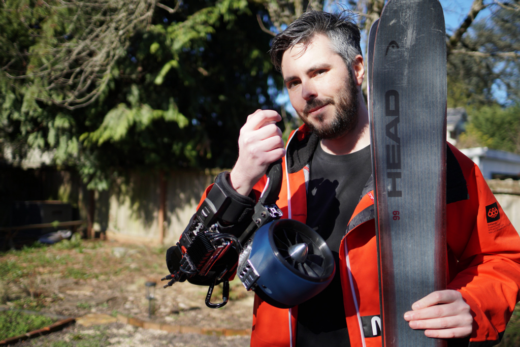 Unleashing the Future of Skiing: My Journey to Jet-Powered Slopes 3 A person skiing down a snowy mountain with electric jet engines strapped to their arms, creating a powerful thrust.