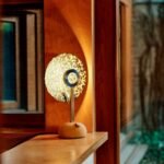 Juba Studio Unveils TL-1 Lamp: A Celestial Glow Born from Sustainable Design 6 The Juba TL-1 Lamp in 'Heaven' colorway, a light-pink conch shell hue, emitting a soft, ethereal glow on a surface.