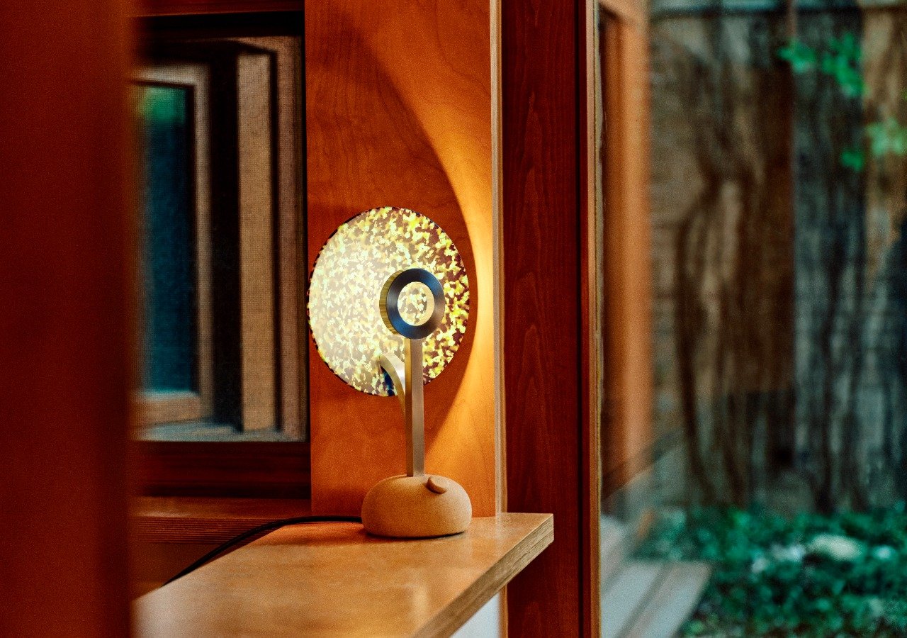 Juba Studio Unveils TL-1 Lamp: A Celestial Glow Born from Sustainable Design 3 The Juba TL-1 Lamp in 'Heaven' colorway, a light-pink conch shell hue, emitting a soft, ethereal glow on a surface.