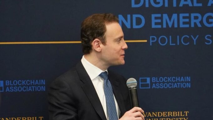 Gavel on a legal document with a background of a sports stadium, symbolizing the legal battle over sports prediction markets.