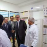Moroccan officials, including Akhannouch and Tahraoui, inspecting a newly upgraded primary health center with modern equipment.