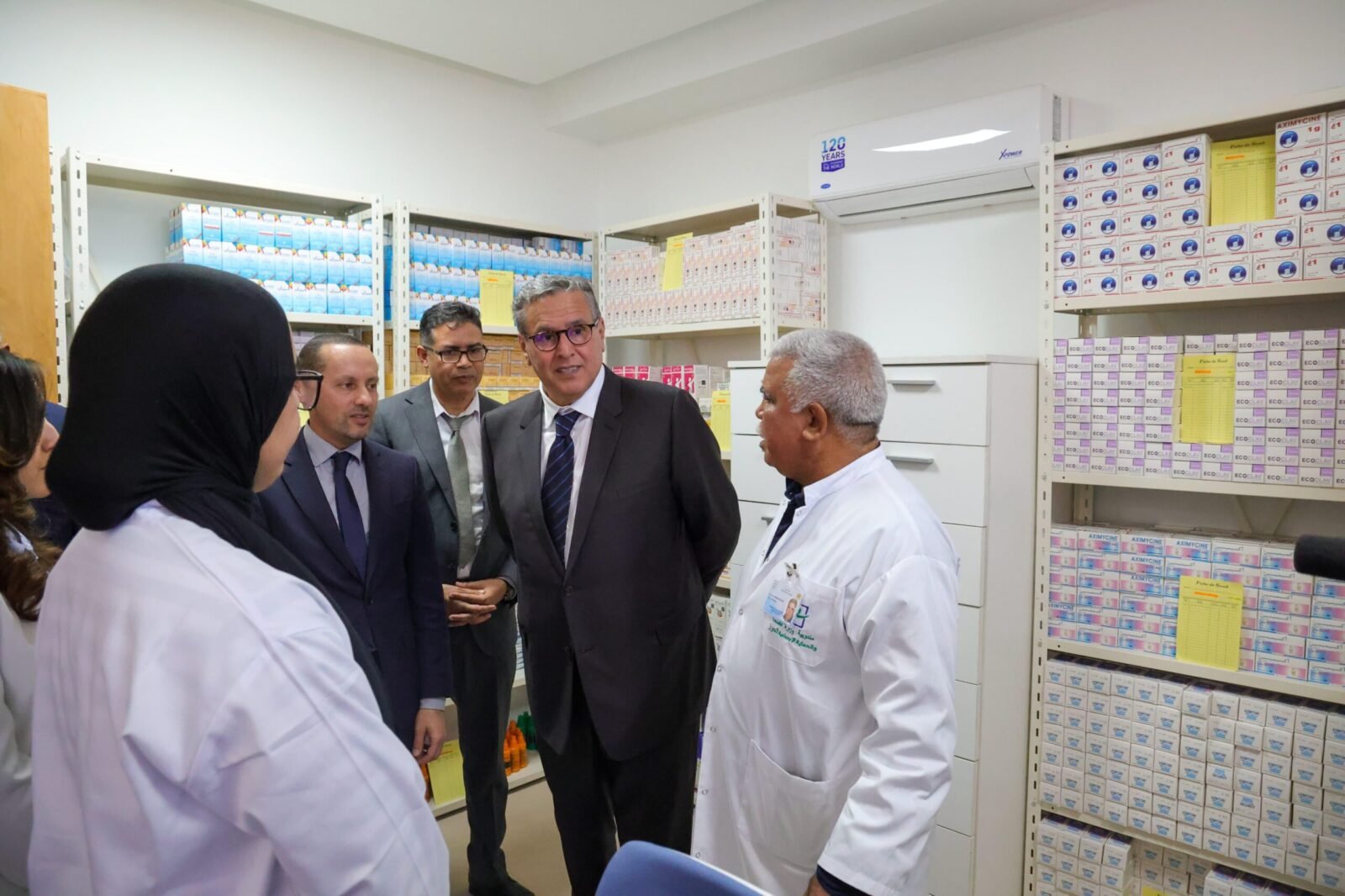 Moroccan officials, including Akhannouch and Tahraoui, inspecting a newly upgraded primary health center with modern equipment.