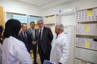 Moroccan officials, including Akhannouch and Tahraoui, inspecting a newly upgraded primary health center with modern equipment.