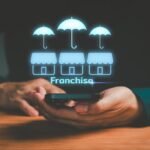 A diverse group of business professionals shaking hands, symbolizing successful multi-concept franchise partnerships and growth.