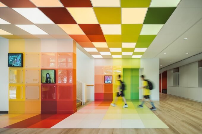 Vibrant music classroom at Wester Academy Beijing designed by studio vapore, featuring colorful acoustic panels and modern furnishings.