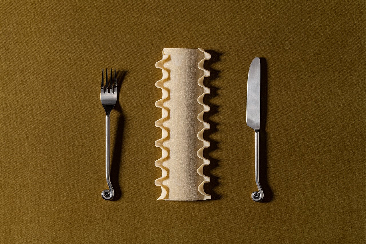 Al Dente Design: The Culinary Artistry Behind Lo & Co's New Hardware Collection 3 Close-up of Al Dente Collection hardware, showing pasta-inspired knobs and pulls in various metallic finishes.