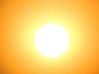 Illustration of a quantum computer attempting to mine Bitcoin, with a distant star in the background symbolizing immense energy requirements.