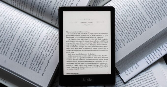 A refurbished 2021 Kindle Paperwhite e-reader displaying text on its screen, highlighting the device's sleek design and readability.