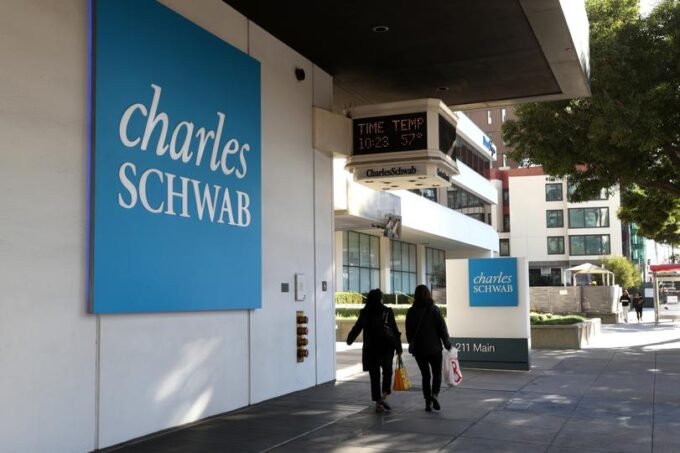 Charles Schwab to Launch Spot Bitcoin and Ether Trading in 2026 9 A modern financial building with 'Schwab' branding, symbolizing Charles Schwab's strategic entry into digital asset trading.