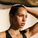 Person sleeping peacefully in bed, representing the link between sleep and daily activity.