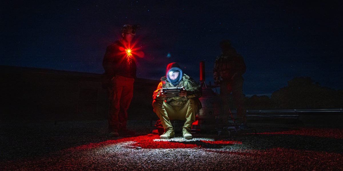 A soldier looking at multiple digital screens, symbolizing data overload, with a phone icon subtly integrated into the scene.