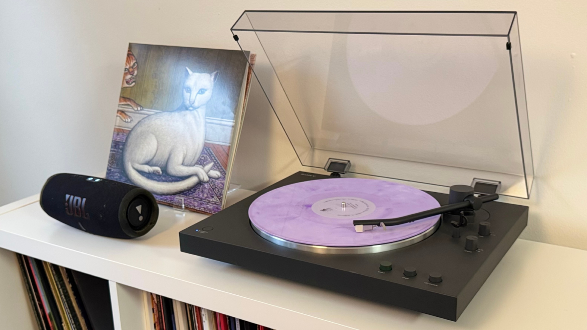 A sleek Sony PS-LX3BT Bluetooth turntable with a vinyl record spinning on its platter, ready for playback.