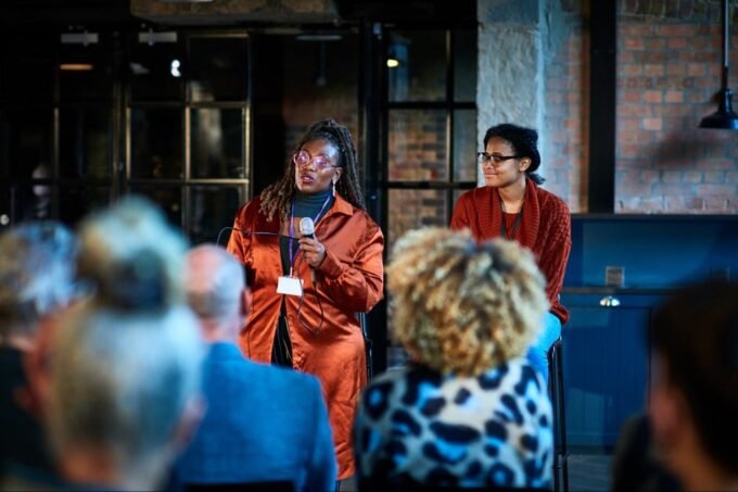 Beyond Buzzwords: How True Thought Leaders Deliver Instant Impact 5 A dynamic image of a thought leader speaking confidently to an engaged audience, symbolizing influence and impact.