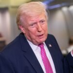 U.S. President Donald Trump speaks with members of the media onboard Air Force One on March 29, 2026, en route to Joint Base Andrews, Maryland.