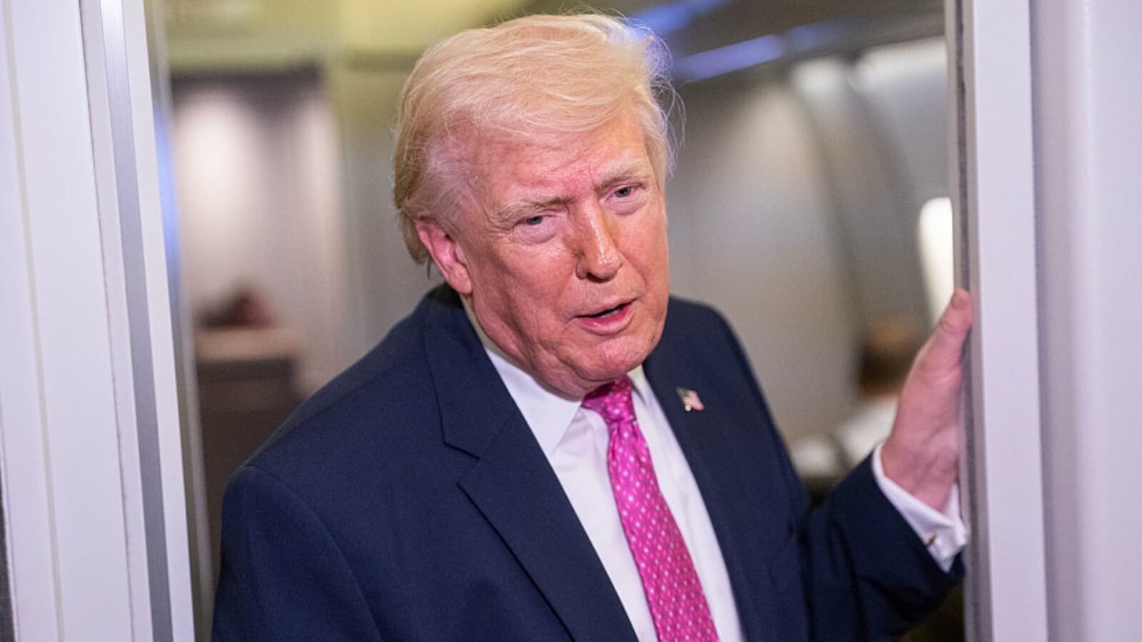 U.S. President Donald Trump speaks with members of the media onboard Air Force One on March 29, 2026, en route to Joint Base Andrews, Maryland.