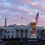 A stadium filled with soccer fans during a World Cup match in the US, symbolizing the economic investment in the sport.