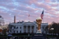 A stadium filled with soccer fans during a World Cup match in the US, symbolizing the economic investment in the sport.