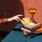 Navigating Tomorrow's Workplace: 4 Essential Reads for Resilience and Leadership 6 A stack of diverse business books on a desk, symbolizing knowledge and resilience in the modern workplace.