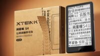 A sleek, compact Xteink S4 e-reader displaying an e-book, held in a hand.