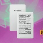 A close-up of the compact Xteink X4 e-reader in Frost White, held in a hand, showcasing its small size and e-ink display.