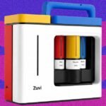 Zuvi ColorBox Review: A Bold Promise, A Fading Reality in At-Home Hair Dye 8 The Zuvi ColorBox hair dye printer on a counter, with base containers and color cartridges, ready for use.