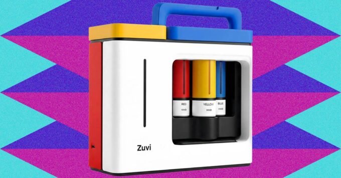 The Zuvi ColorBox hair dye printer on a counter, with base containers and color cartridges, ready for use.