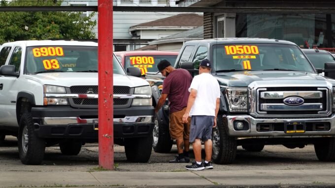 Used cars displayed for sale at a dealership in Chicago, Illinois.