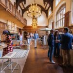 A vibrant scene from Clerkenwell Design Week 2026, showcasing innovative design installations and engaged attendees.