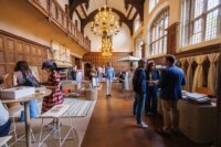 A vibrant scene from Clerkenwell Design Week 2026, showcasing innovative design installations and engaged attendees.