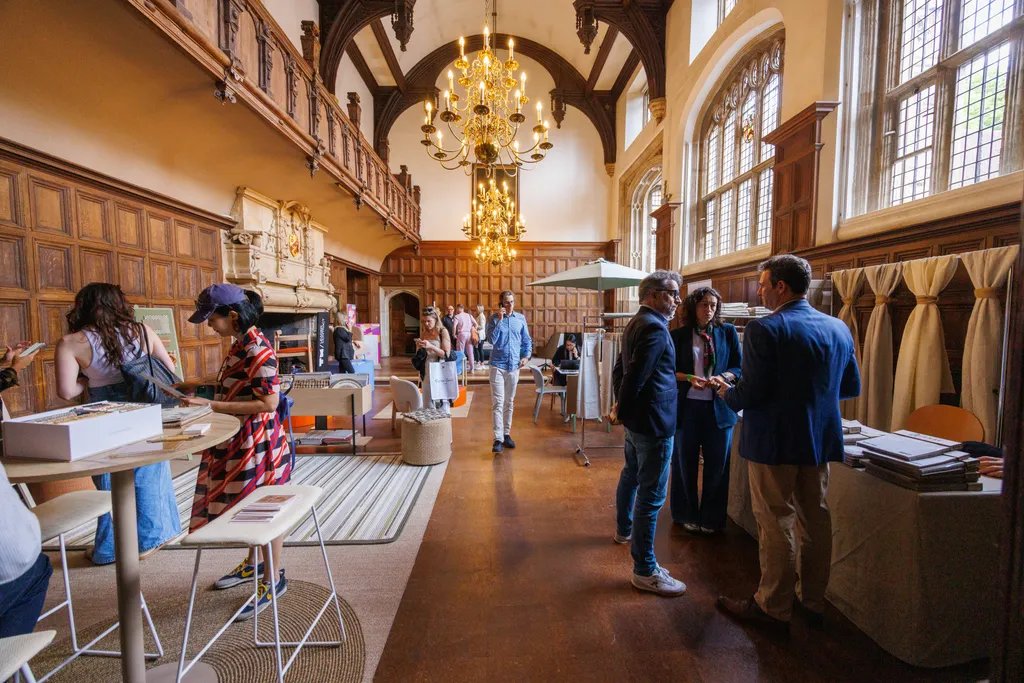 A vibrant scene from Clerkenwell Design Week 2026, showcasing innovative design installations and engaged attendees.