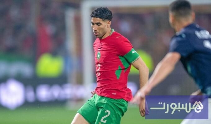 صورة لأشرف حكيمي بقميص المنتخب المغربي يعبر عن طموحات الفريق في كأس العالم.